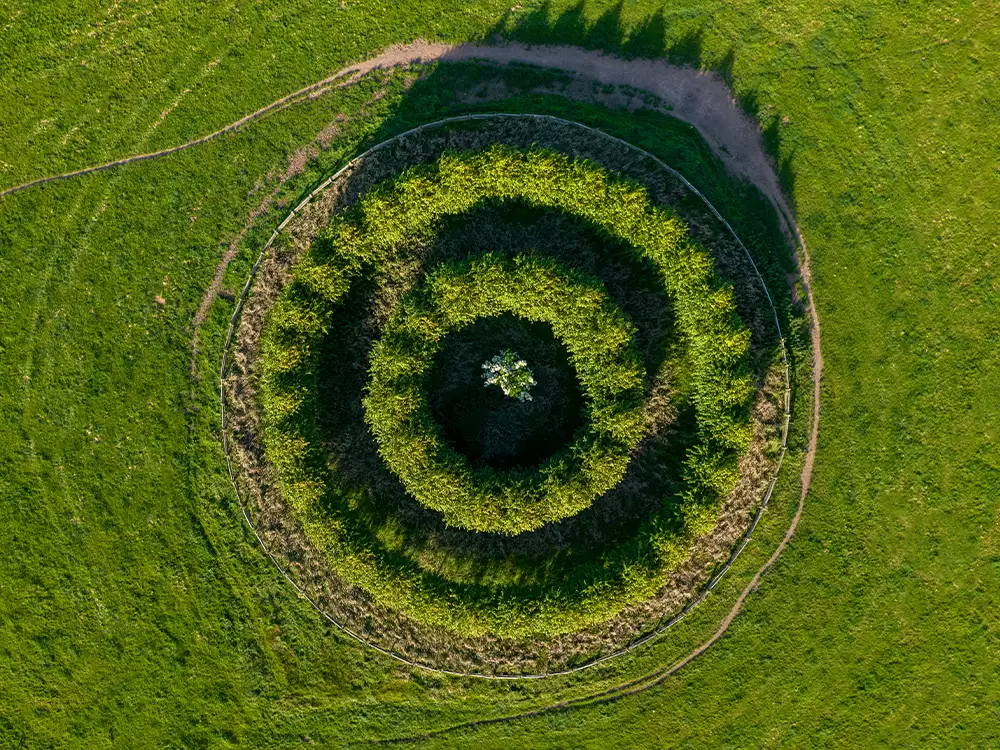 Top down view of green spiral hilltop